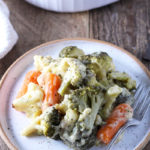 Creamy vegetable bake packed with carrots, broccoli, cauliflower, and lots of cheese!