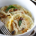 Butternut squash ravioli made super easy with wonton wrappers! Served with creamy and sweet brown butter sage sauce and homemade candied walnuts.