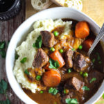 Insanely tender, fall-apart beef, carrots and peas smothered in rich gravy made with Jameson whiskey and Guinness beer. This stew packs incredible flavor and is served over creamy garlic mashed potatoes, making it the ultimate comfort food. Slow cooked in the crockpot, it’s easy to make and perfect for feeding a crowd on St. Patrick’s Day!