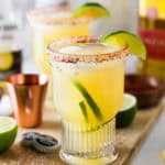 Crisp and refreshing margarita that is perfectly balanced with fresh lemon and lime juice, natural sweetener and tequila then topped off with Corona Extra and served in a glass with a chili-lime salt rim.