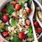 Summer pasta salad that’s perfect for BBQs and parties! This flavor-packed strawberry and goat cheese pasta salad is the perfect combination of pasta, fresh strawberries, baby spinach, tangy goat cheese (or feta), walnuts and homemade lemon poppy seed dressing. It’s a definite crowd pleaser!