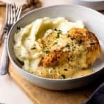 Tender and juicy chicken breasts smothered in the most insanely delicious dijon mustard cream sauce served over fluffy mashed potatoes. The chicken and sauce are all made in one skillet, making it an easy dinner. Perfect for date night or a casual weeknight night. Everyone will love this recipe!