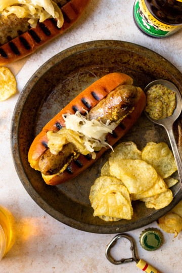 Grilled Beer Boiled Brats with Beer Caramelized Onions - Modern ...