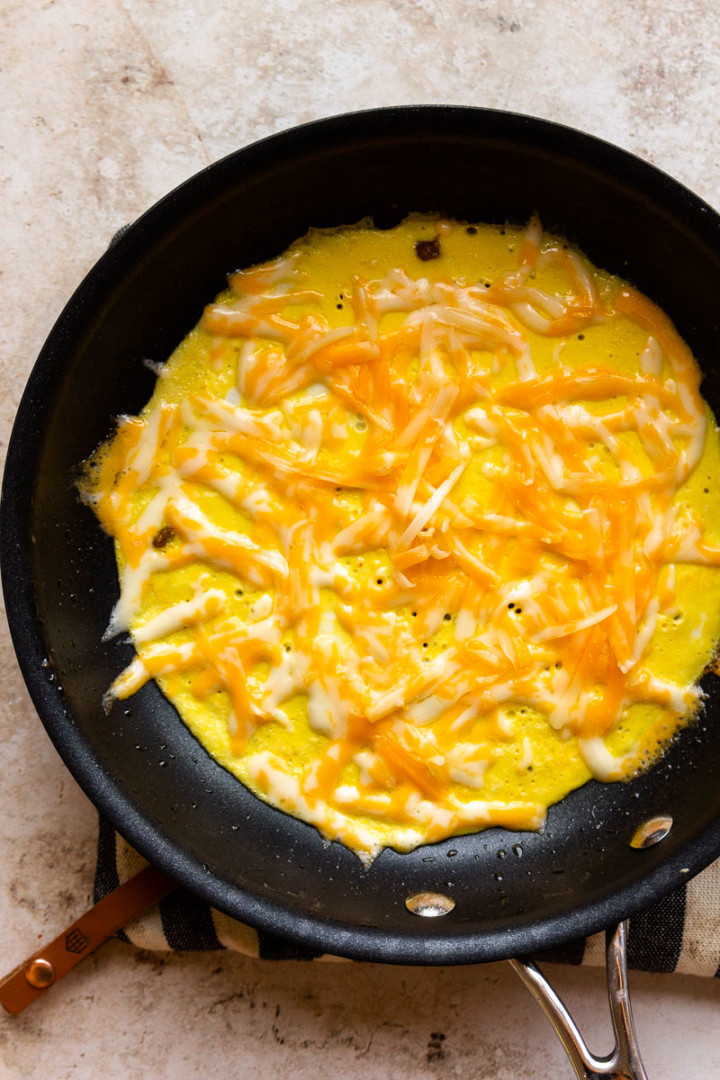 egg in pan with cheese