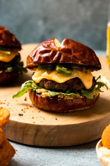 Beer Cheese Burgers on Pretzel Buns with Caramelized Beer Onions and ...