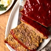 sliced stuffing meatloaf on a serving platter