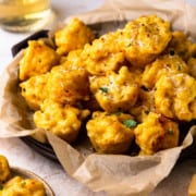 baked mac and cheese bites on a serving platter