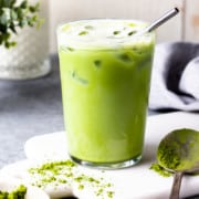 iced matcha latte in a glass with a straw