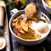 Scooping apple mug cake out of the mug with a spoon