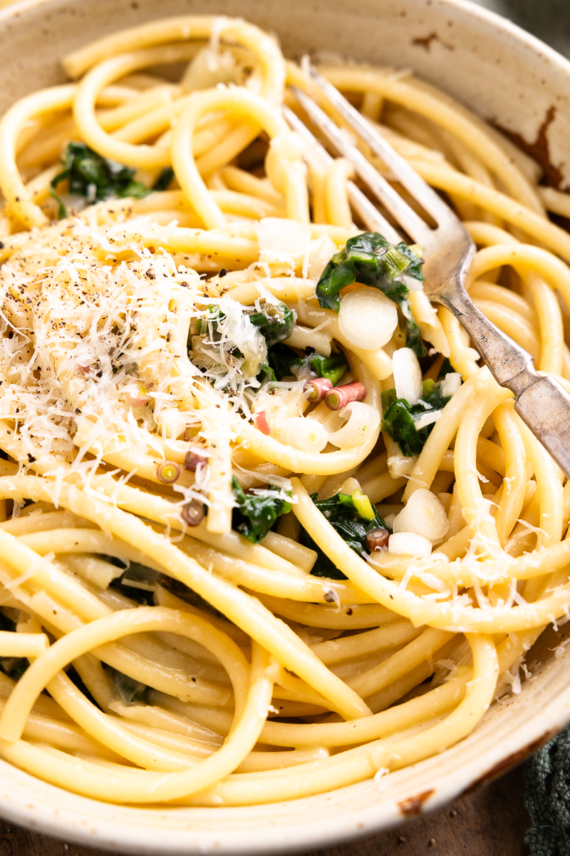 close up of ramp pasta in a bowl with a fork