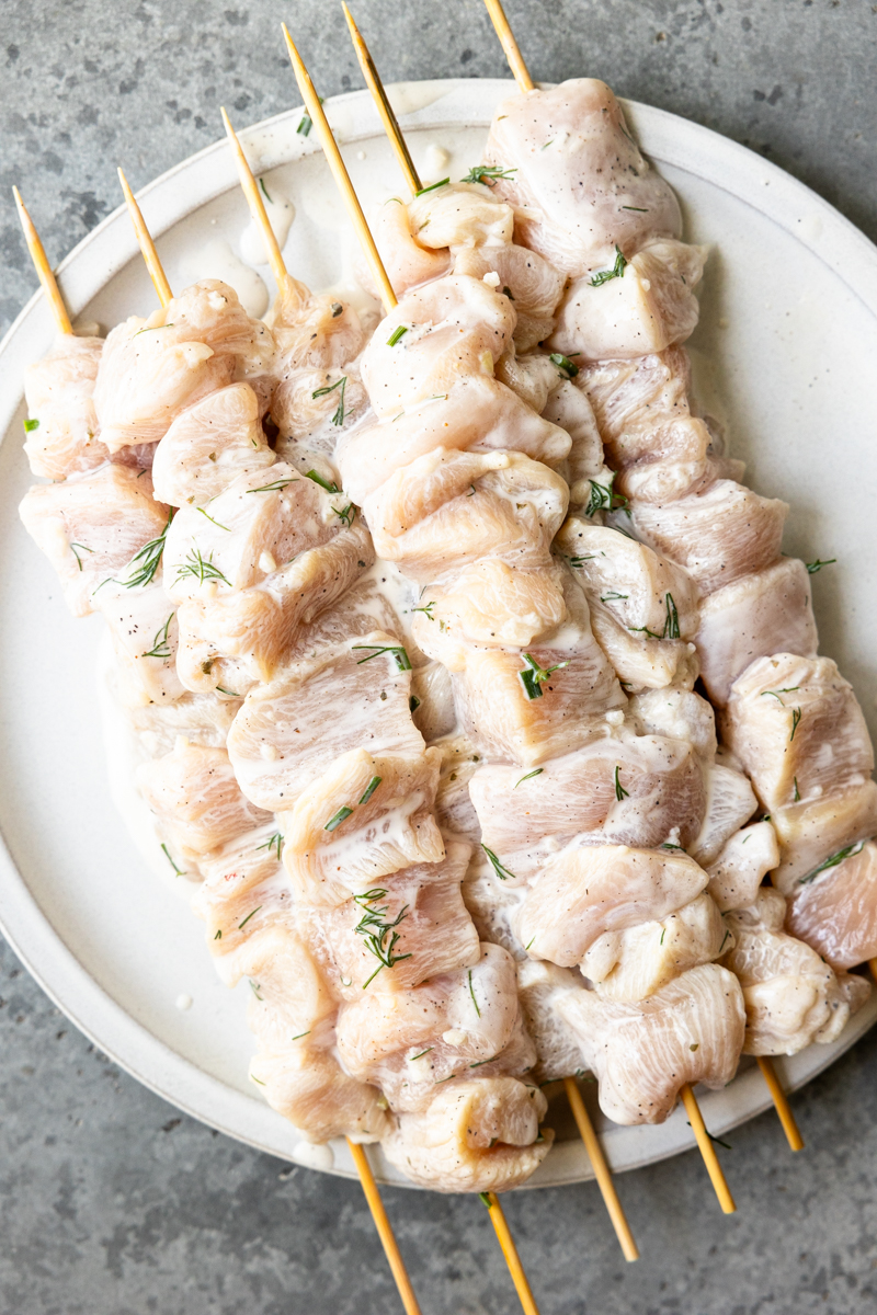 marinated chicken pieces on skewer sticks