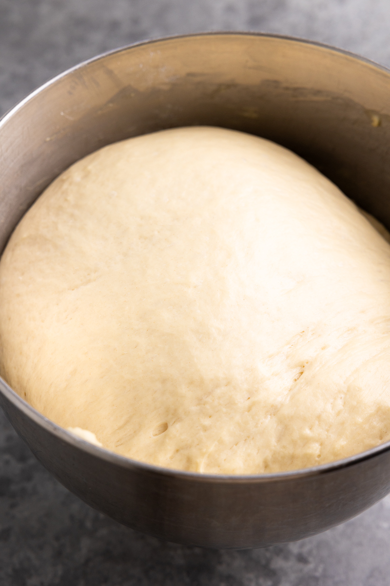 dough in a bowl after it's first rise