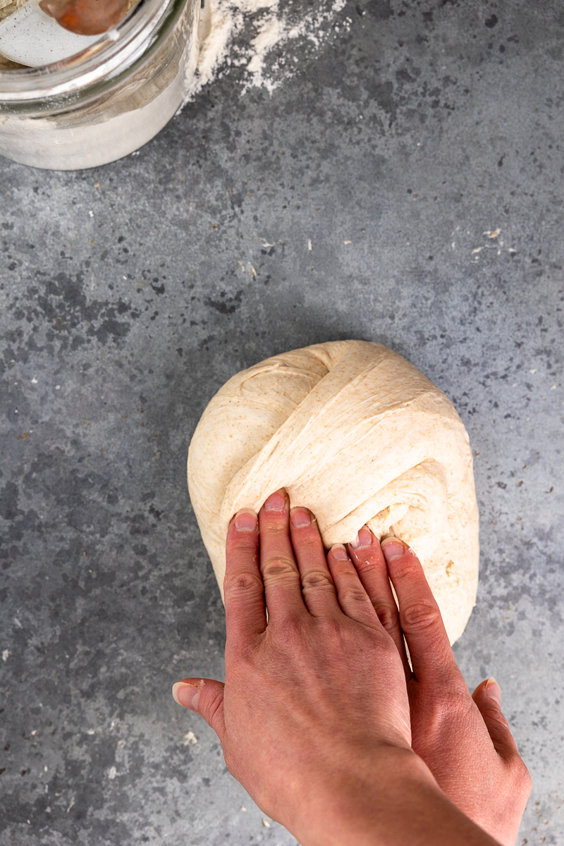 pulling in the top right corner of the dough