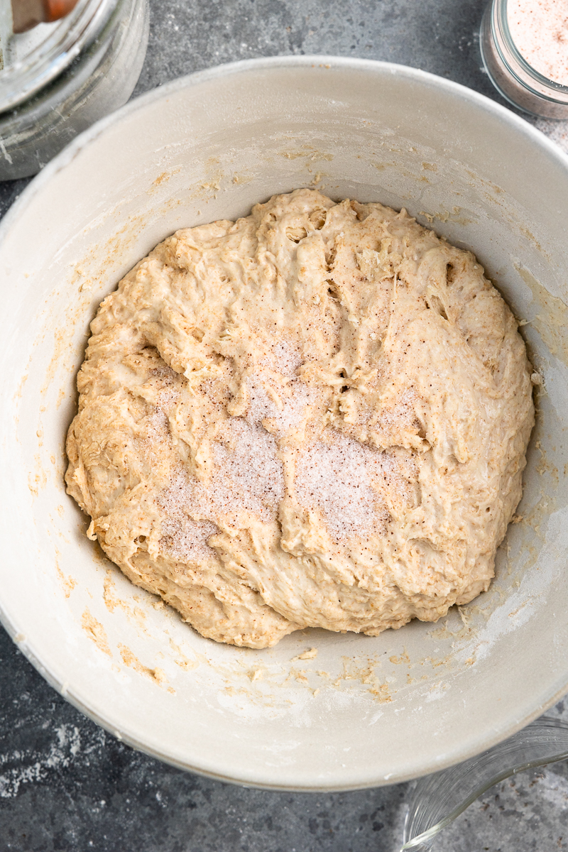 sourdough leaven, water and flour mixed in a bowl with salt on top